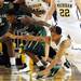 Michigan sophomore Trey Burke reaches for a loose ball out of his grasp as Cleveland State sophomore Charlie Lee connects with the ball during the first half of an NIT Season Tip-Off game at Crisler Center on Tuesday. Melanie Maxwell I AnnArbor.com